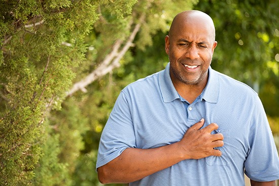 A person holding his chest

Description automatically generated